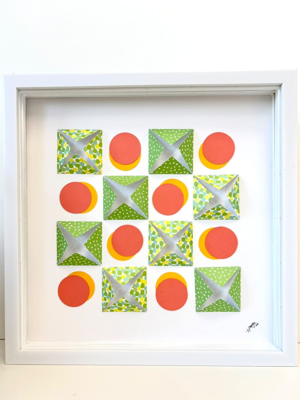 Framed petal grid pattern in green, red and yellow