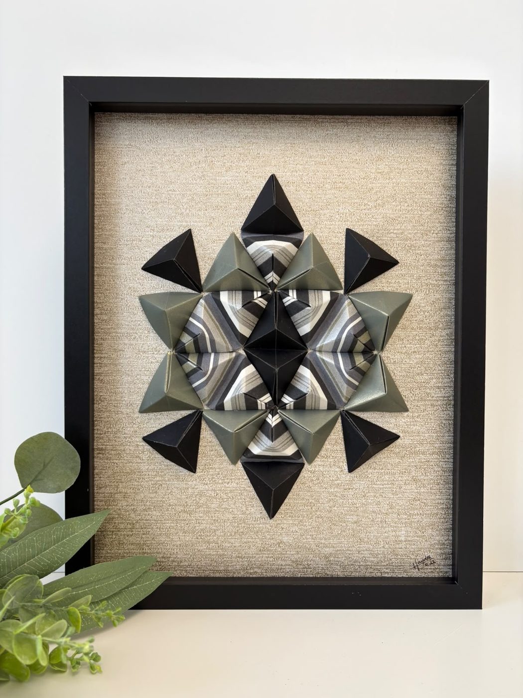 Framed origami star wall piece in grey and black